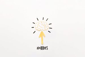 The word hobbies with an arrow pointing up to a brain