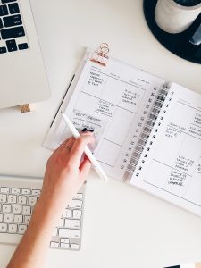 tasks-written-in-notebook-on-a-desk